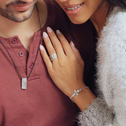 woman wearing sterling silver stackable name rings