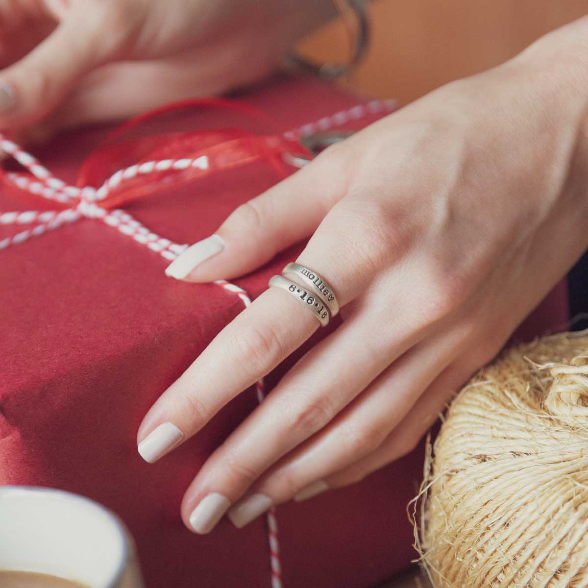 girl wearing Personalized sterling silver stackable name rings