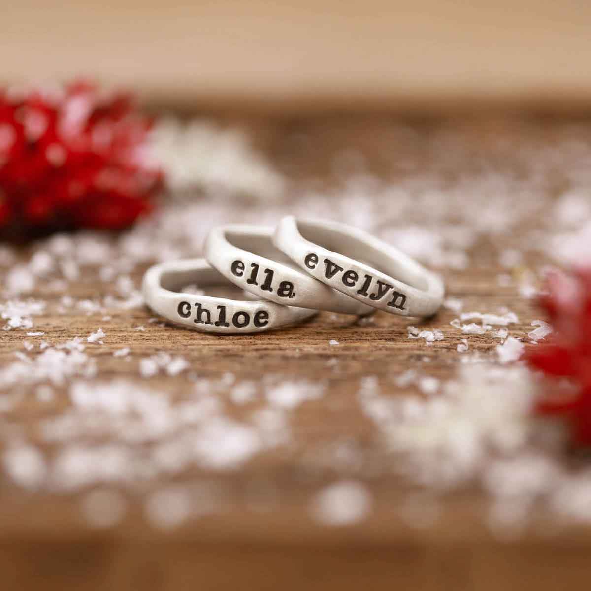 Woman wearing her Personalized sterling silver stackable name rings