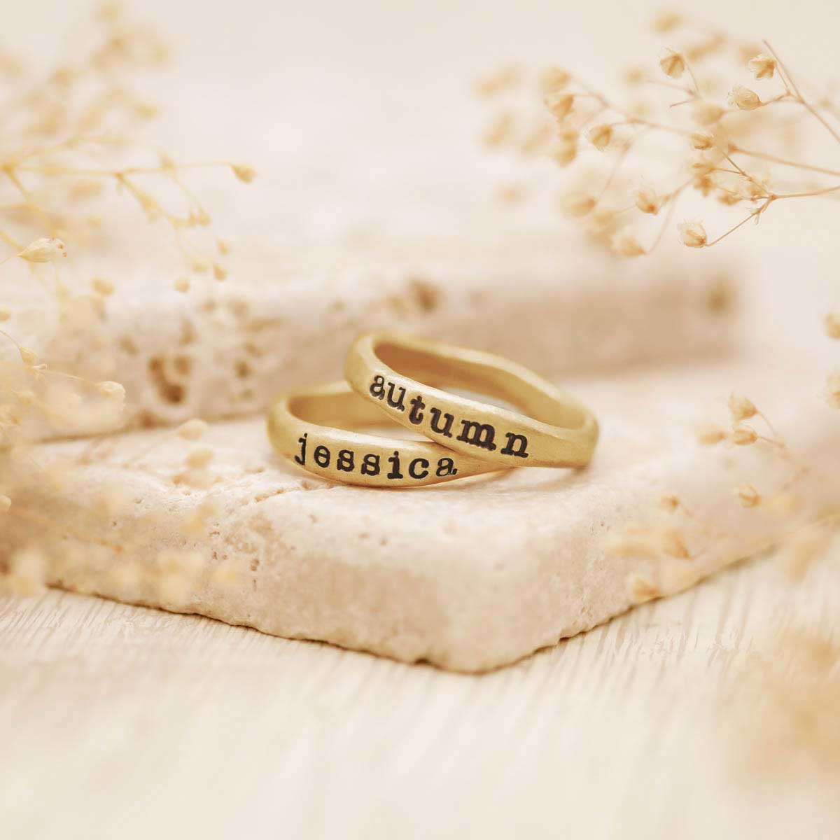 Two Personalized 14k yellow gold stackable name rings