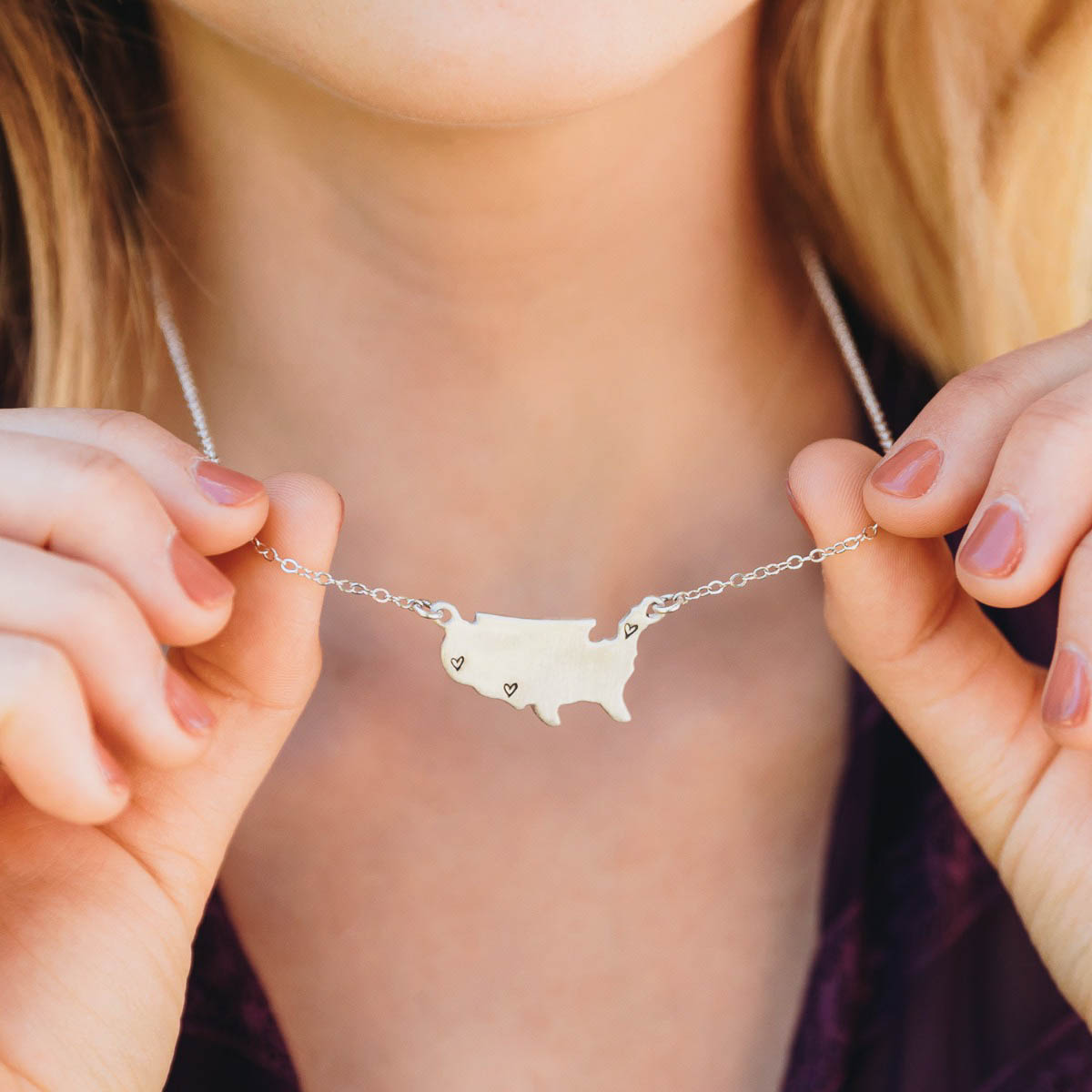 girl wearing sterling silver state of my heart necklace