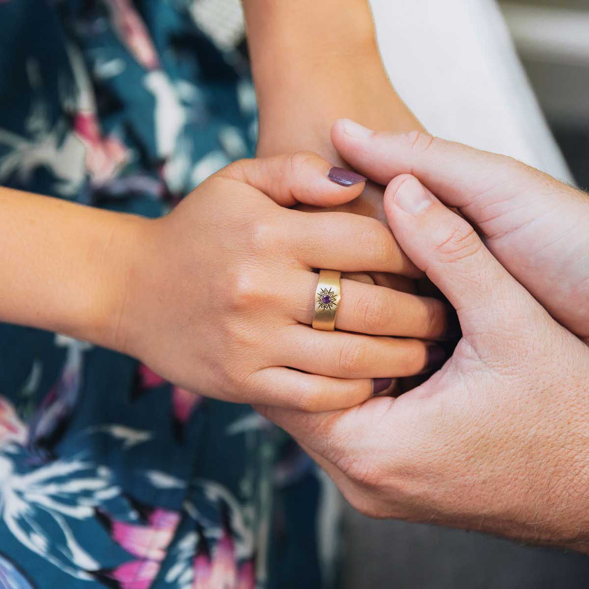 Girl wearing Sunburst birthstone ring handcrafted in 14k yellow gold and set with a birthstone of your choice