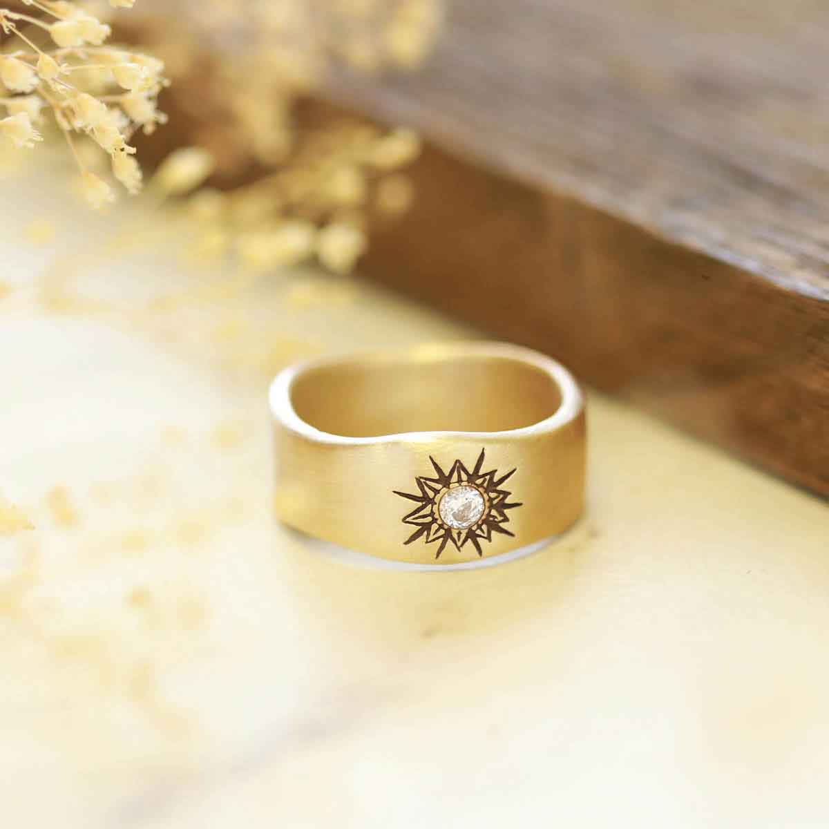 10k yellow gold sunburst diamond ring with a 3mm conflict free diamond 