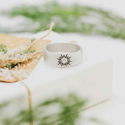 sterling silver sunburst ring on white gift box