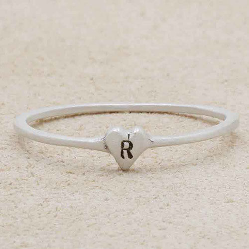 girl holding sterling silver Sweet Love Initial Ring - One Heart