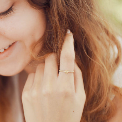 girl wearing 10k yellow gold Sweet Love Initial Ring - One Heart  personalized with an initial