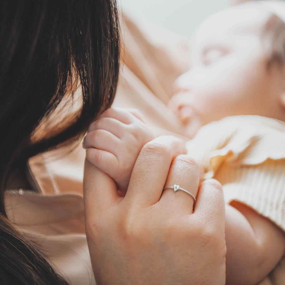 girl wearing sterling silver Sweet Love Initial Ring - One Heart