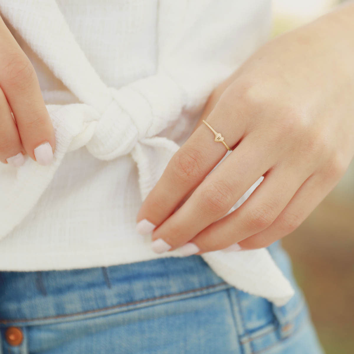 girl wearing 10k yellow gold Sweet Love Initial Ring - One Heart  personalized with an initial