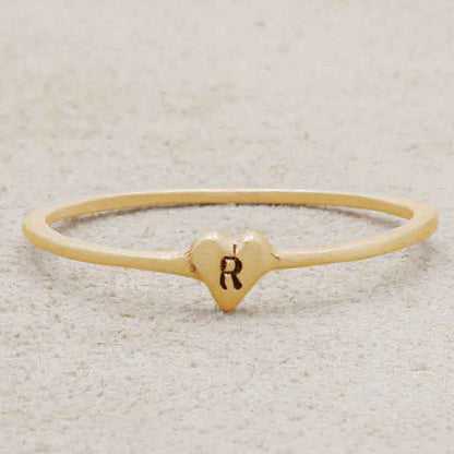 girl wearing 14k yellow gold Sweet Love Initial Ring - One Heart personalized with an initial