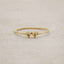 10k yellow gold Sweet Love Initial Ring - Two Hearts, personalized with two initials, on a beige background