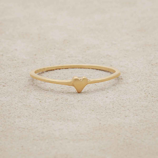 10k yellow gold sweet love ring - one heart on suede background