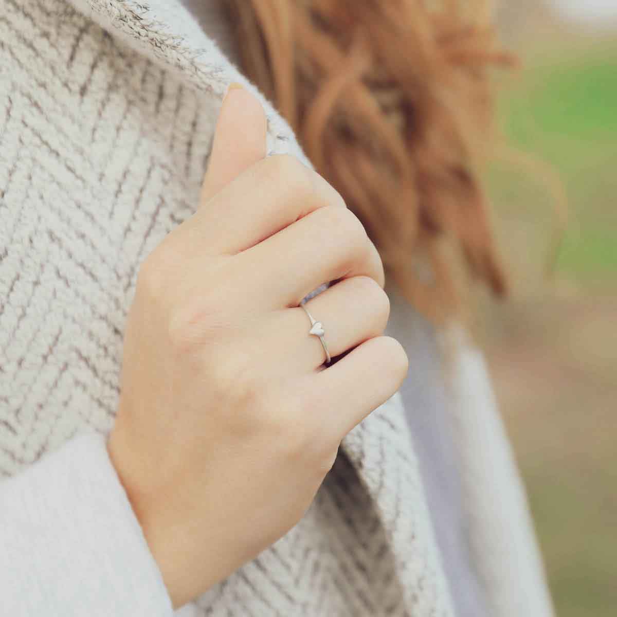 girl wearing a sterling silver sweet love ring - one heart 