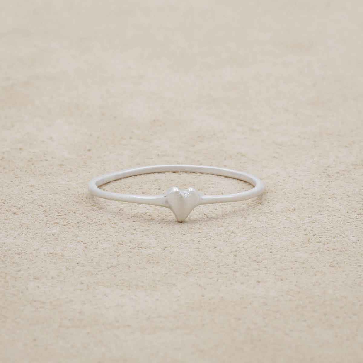 sterling silver sweet love ring - one heart on a marble background