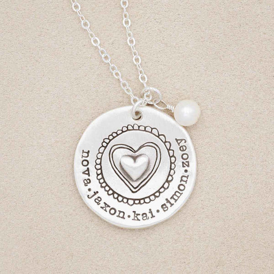 Personalized sterling silver original brave love necklace with a matte brushed finish and strung on a sliver link chain