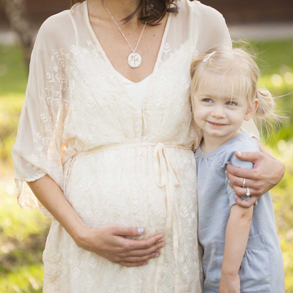 mother wearing the sterling silver original family tree necklace