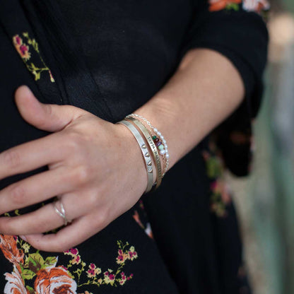 Woman wearing her thin gold cuff 10k gold