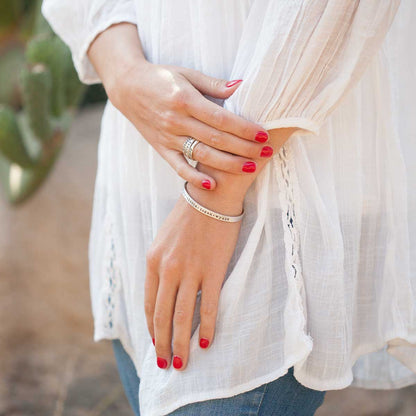 Woman wearing her thin sterling silver cuff