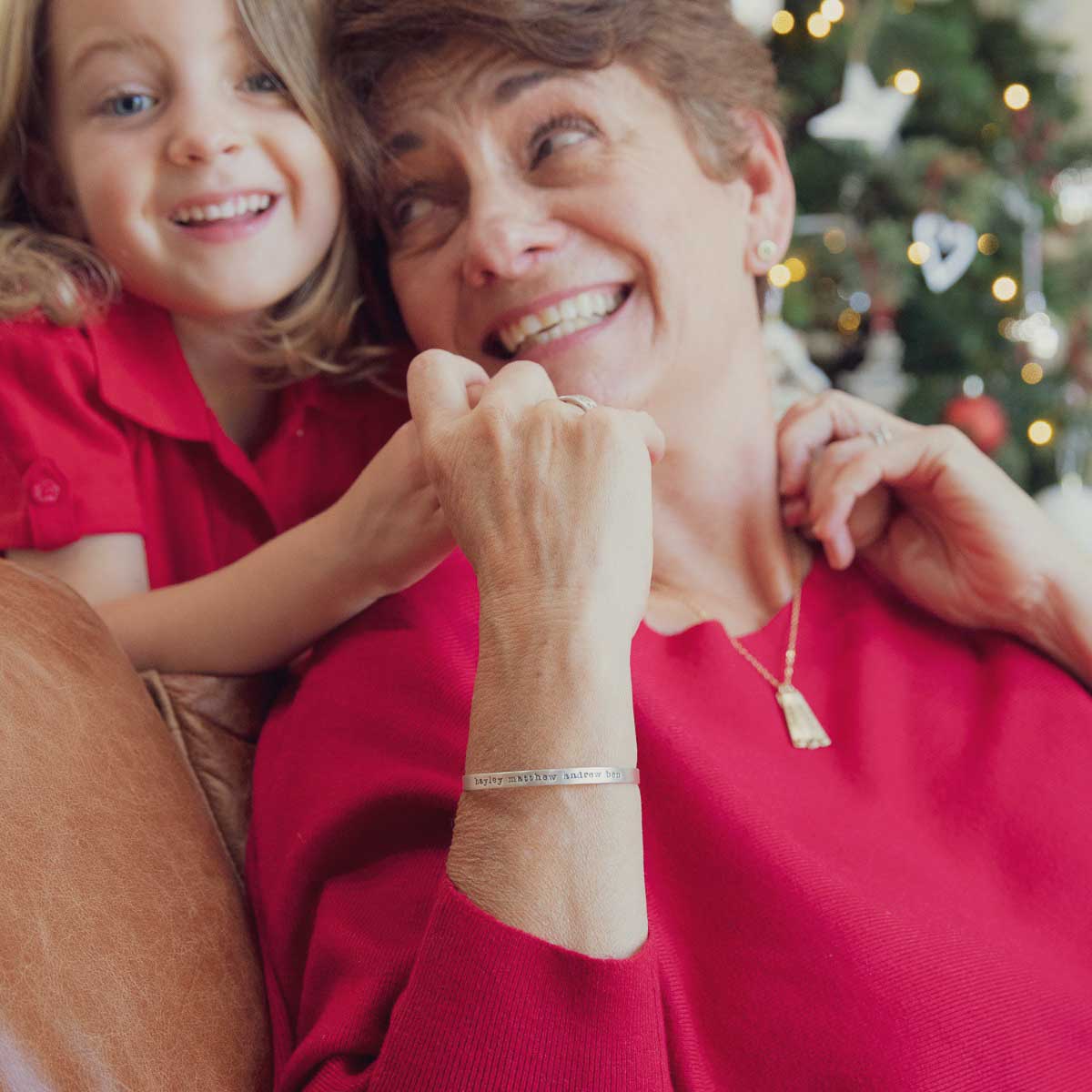 grandma wearing a personalized Thin Sterling Cuff cast in Sterling Silver with a freshwater pearl