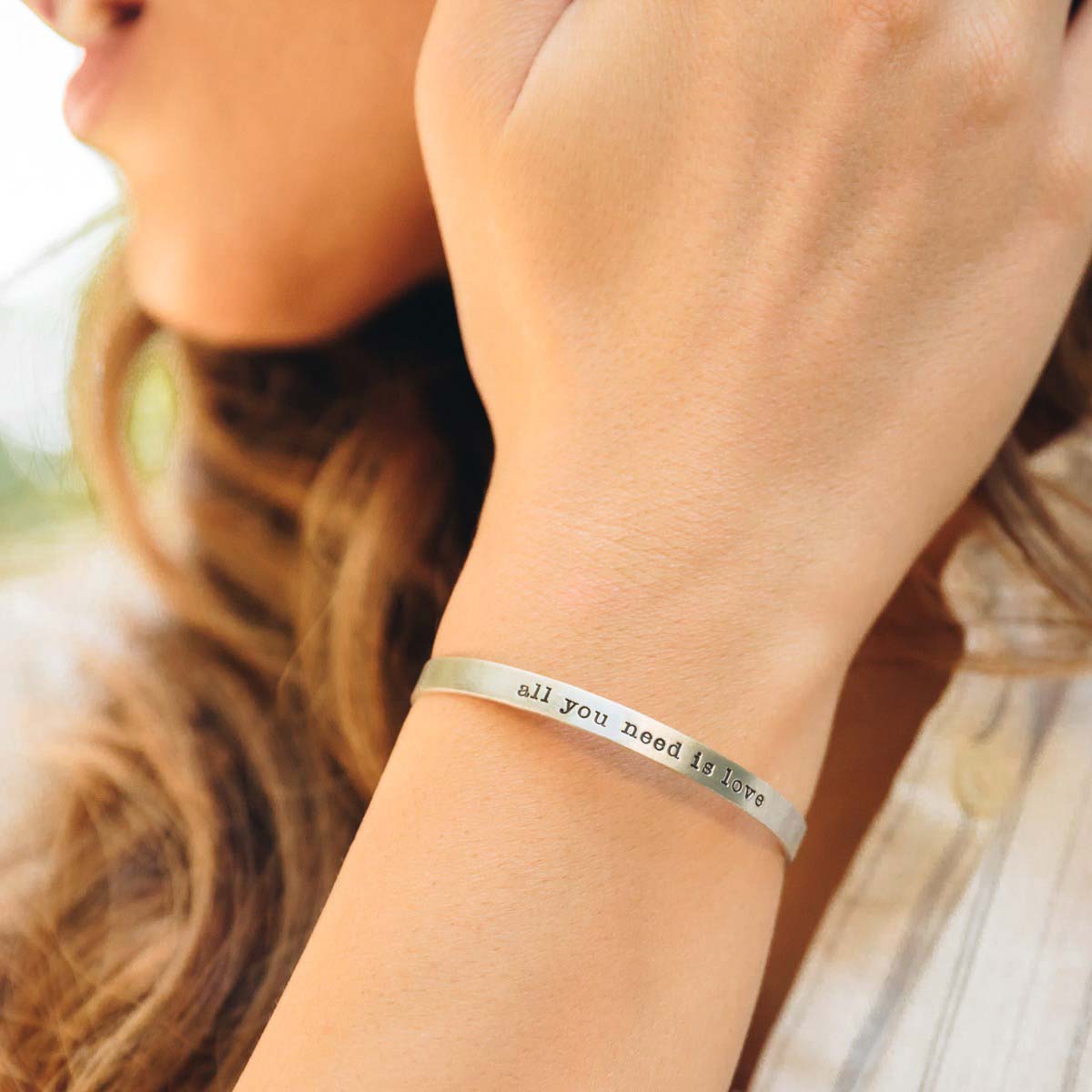 Woman wearing a thin sterling silver cuff