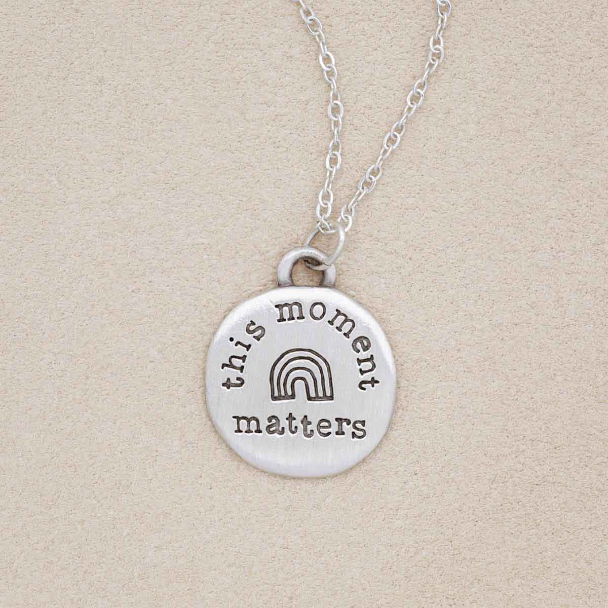 this moment matters pewter necklace on beige background