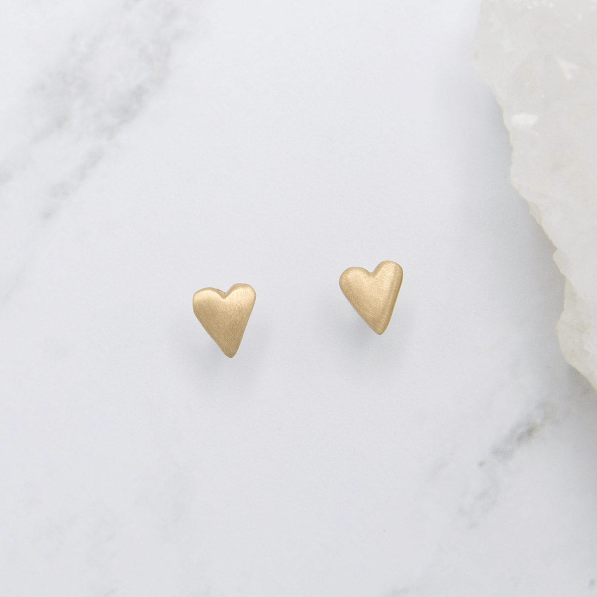 10k yellow gold tiny heart stud earrings with a matte brushed finish