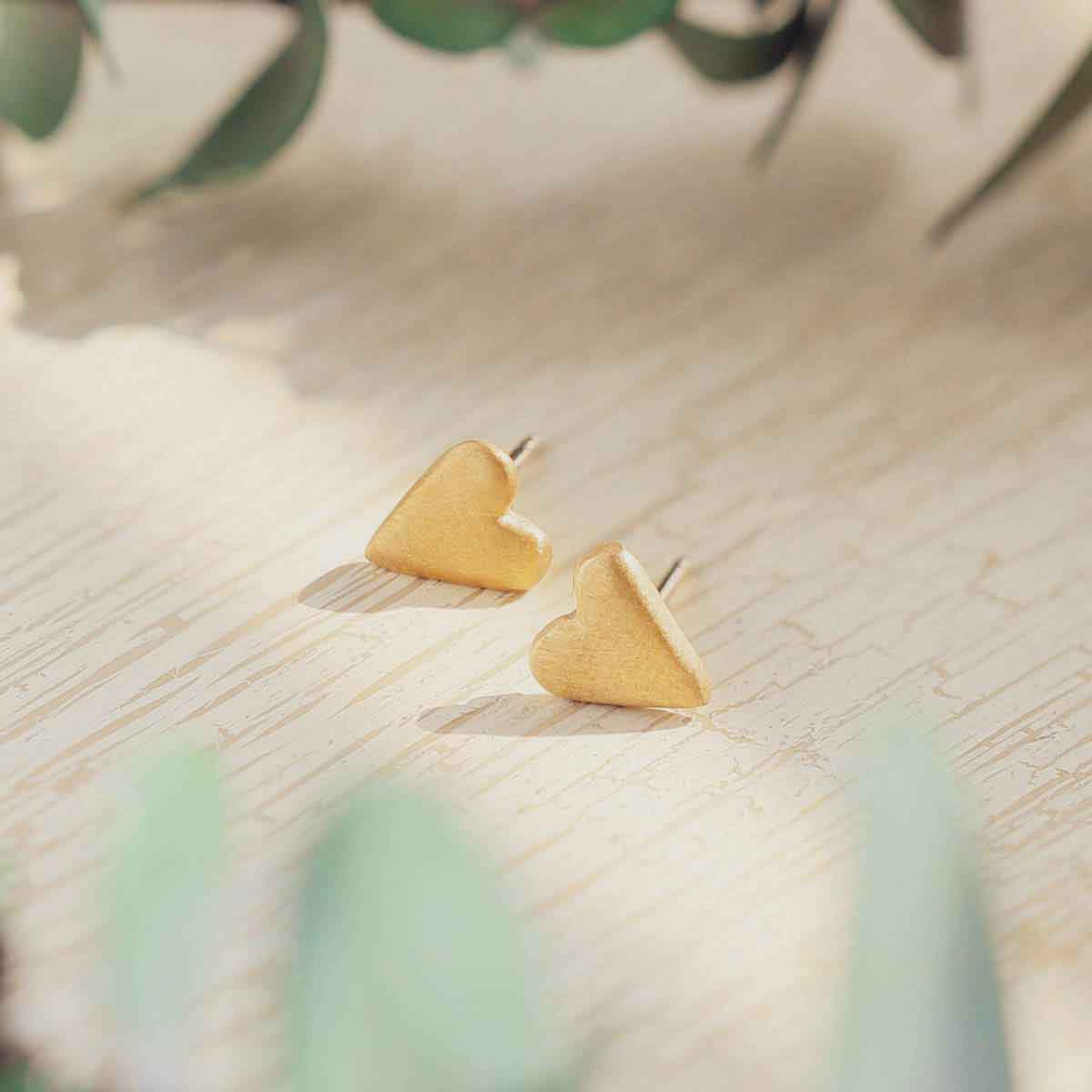 10k yellow gold tiny heart stud earrings with a matte brushed finish