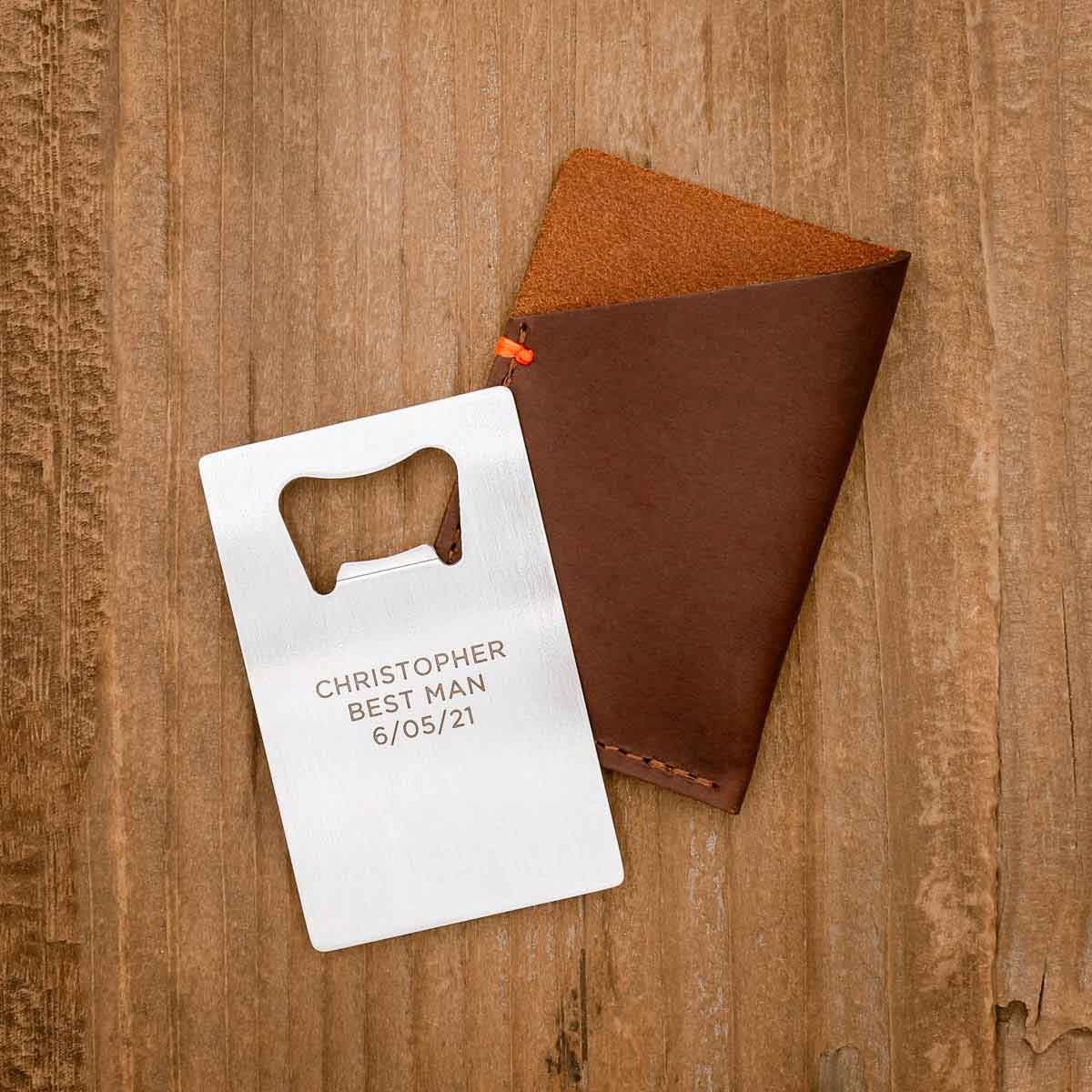 Personalized Trailblazer Bottle Opener and Leather Wallet on wood background