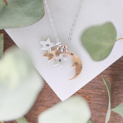 Twinkle little stars necklace with sterling silver and bronze star and moon charms personalized with initials