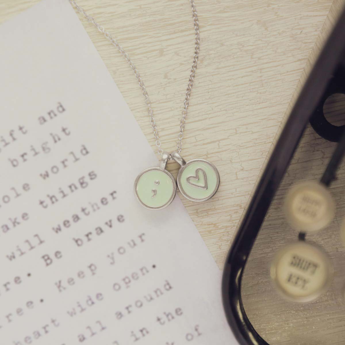 typewriter initial pewter necklace filled with light green epoxy