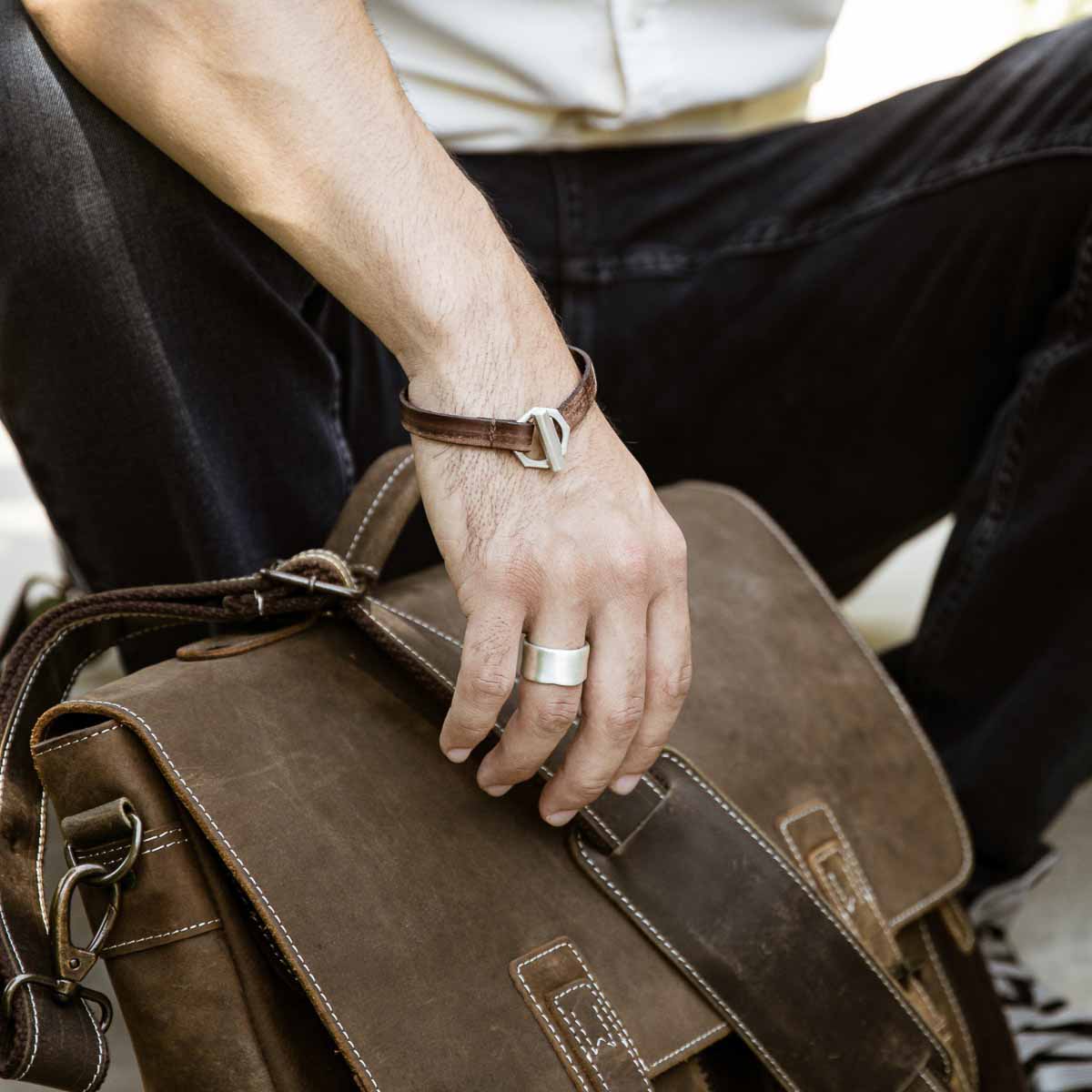 Man displaying Valor Wide ring handcrafted in sterling silver customizable with a meaningful name