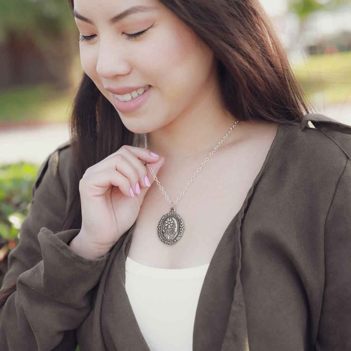 girl wearing a pewter vintage cameo necklace