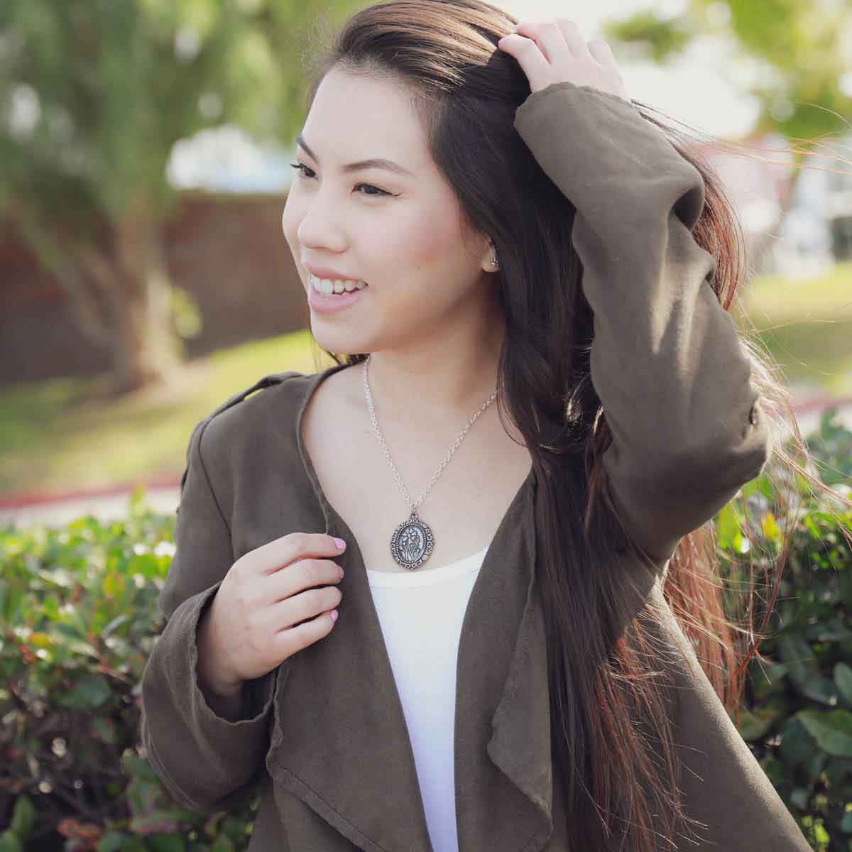 girl wearing a pewter vintage cameo necklace