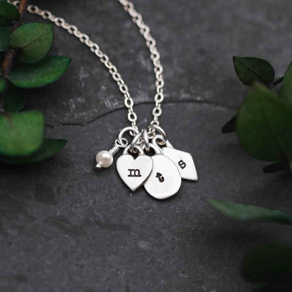 Handcrafted sterling silver Wild about you initials necklace with personalized initials and a 3mm freshwater pearl