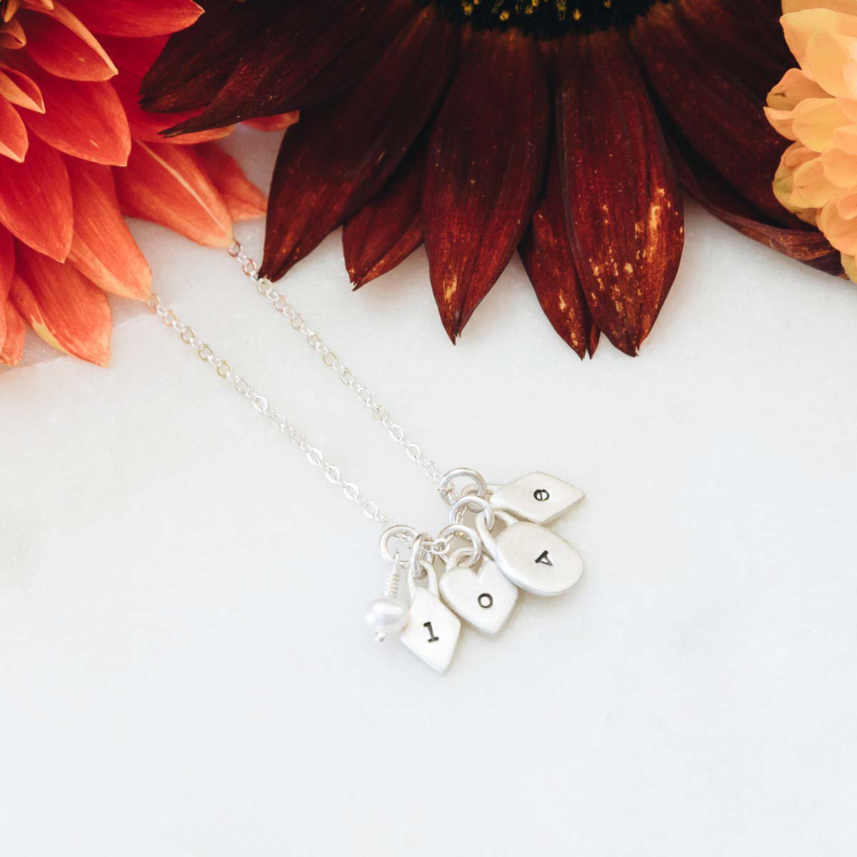 sterling silver wild about you initials necklace with personalized initial charms and tiny freshwater pearl