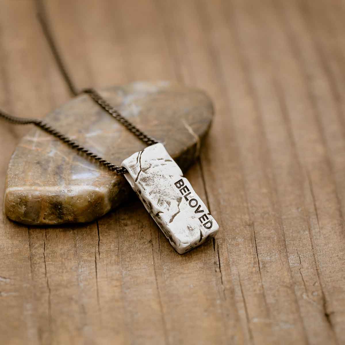 Word of the Year necklace handcrafted in textured, antiqued sterling silver, strung on choice of chain, and personalized with a hand-stamped name, word or date