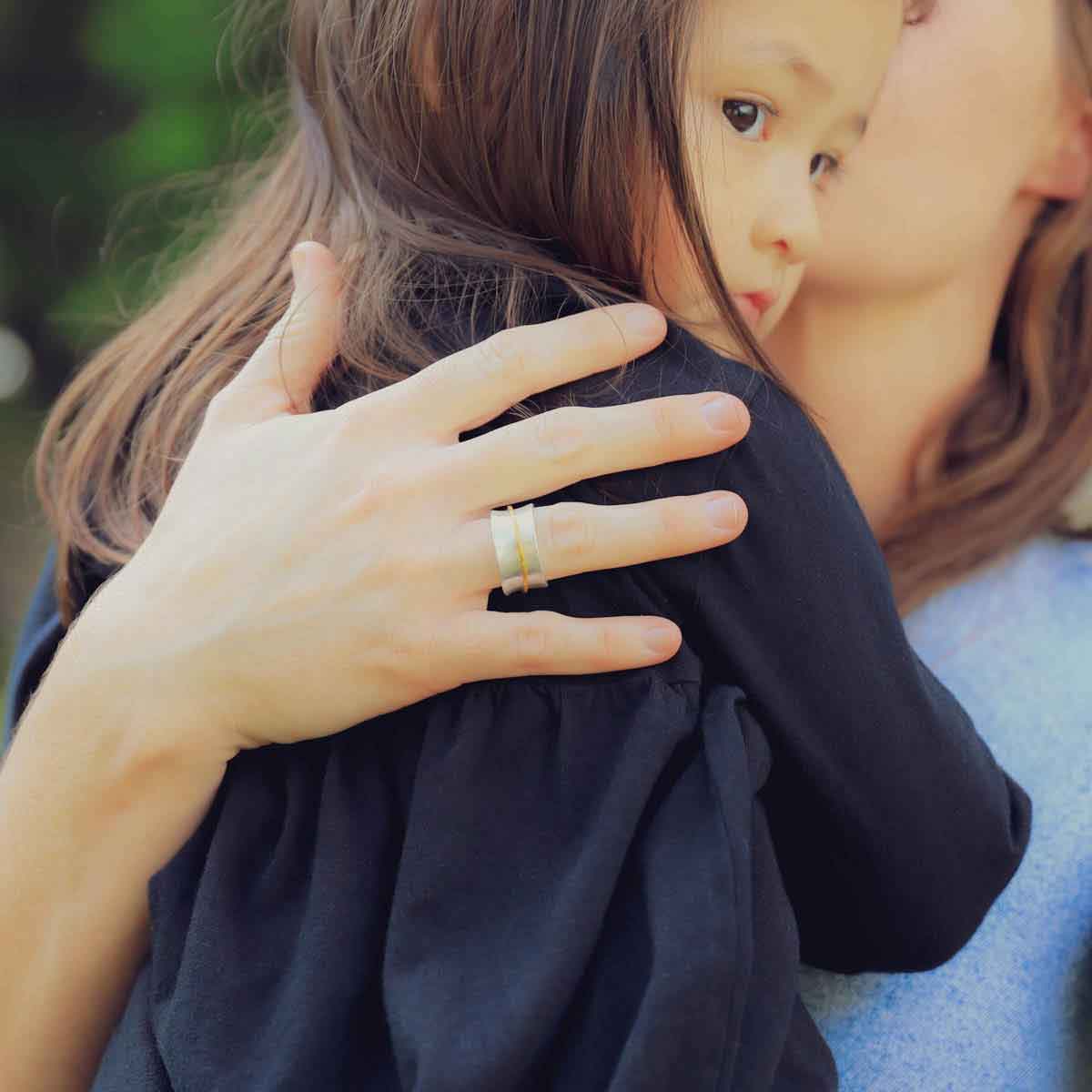 close up of girl wearing the you have my heart spinner ring {sterling silver & 10k gold}