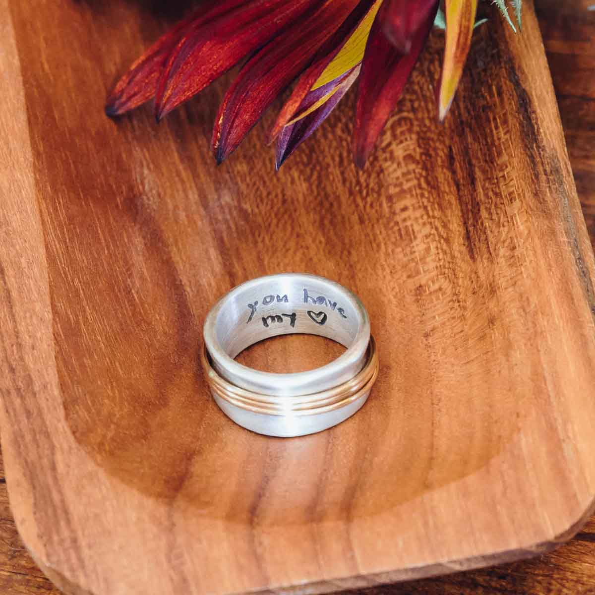 You Have my Heart Spinner ring with a sterling silver band and gold-filled spinners and phrase engraved on the inside