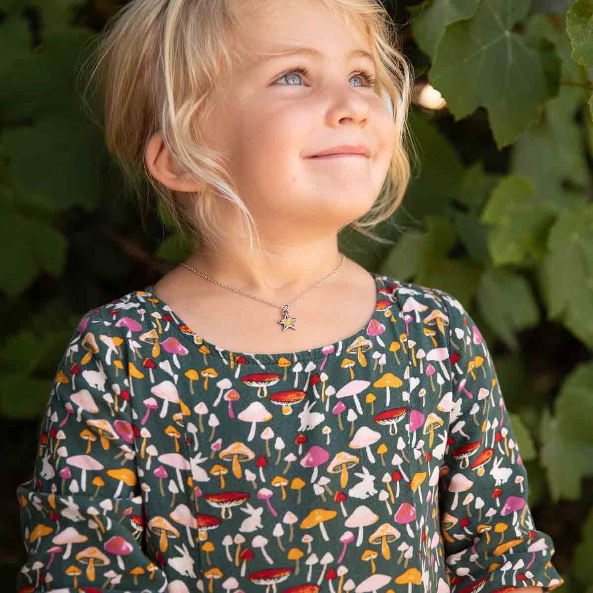 little girl wearing your spark kids necklace