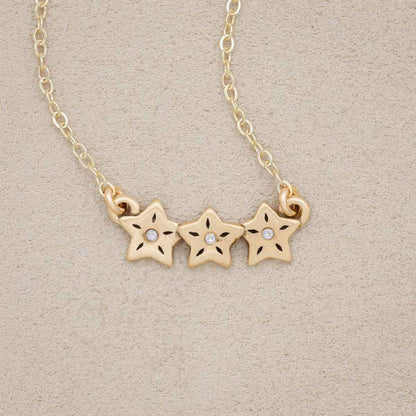 10k yellow gold your spark necklace with 1.5mm cubic zirconia in each star and strung on gold-filled chain chain