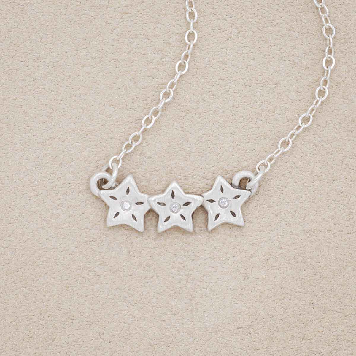 sterling silver your spark necklace with 1.5mm cubic zirconia in each star and strung on silver link chain